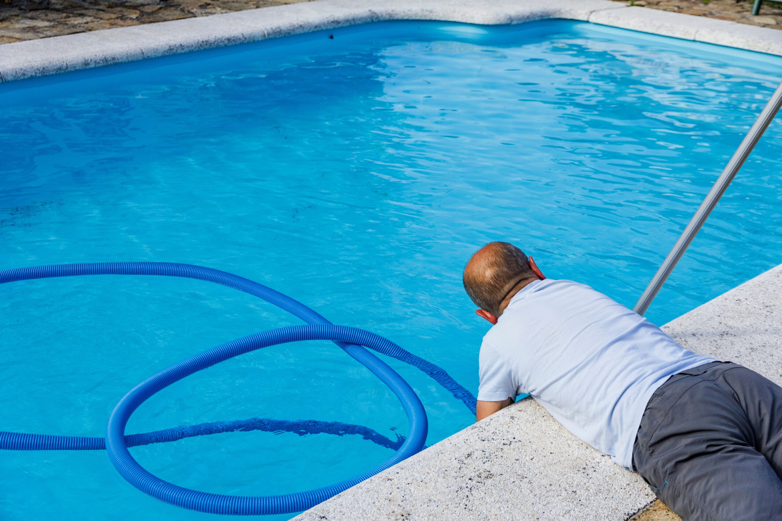 man cleaning the pool at home lying on the floor 2023 11 27 04 49 00 utc scaled